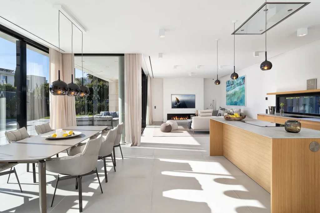 The design of the villas uses light colors and natural textures