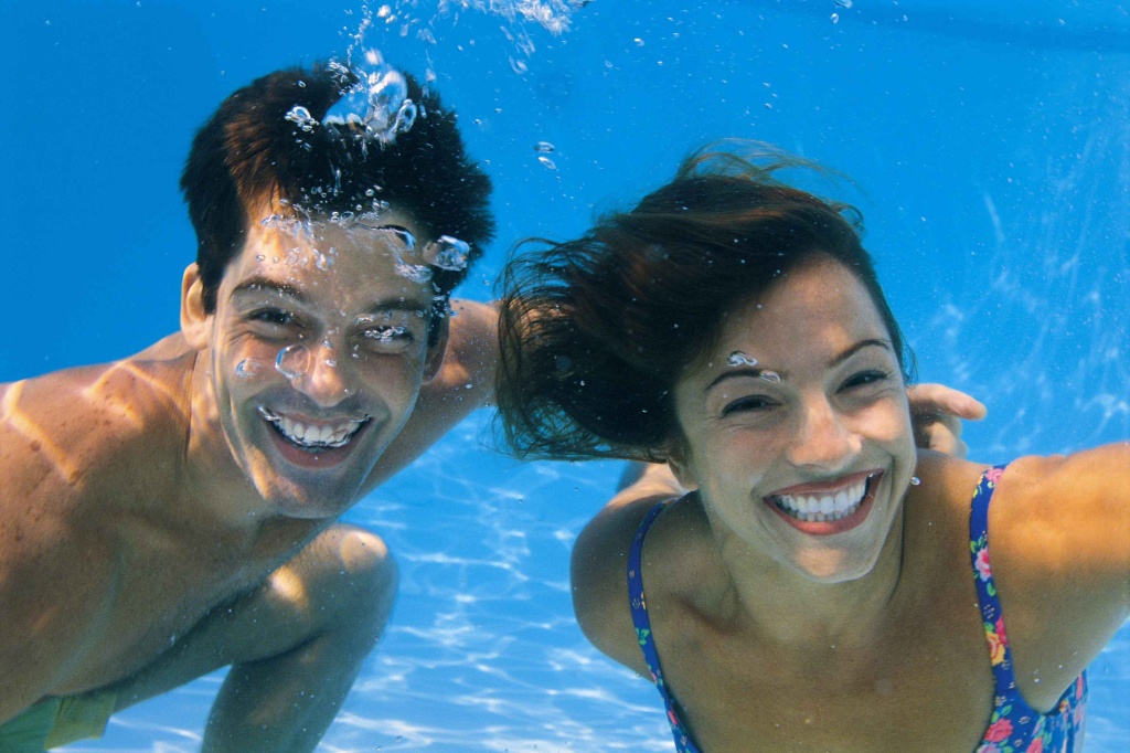 couple swim underwater