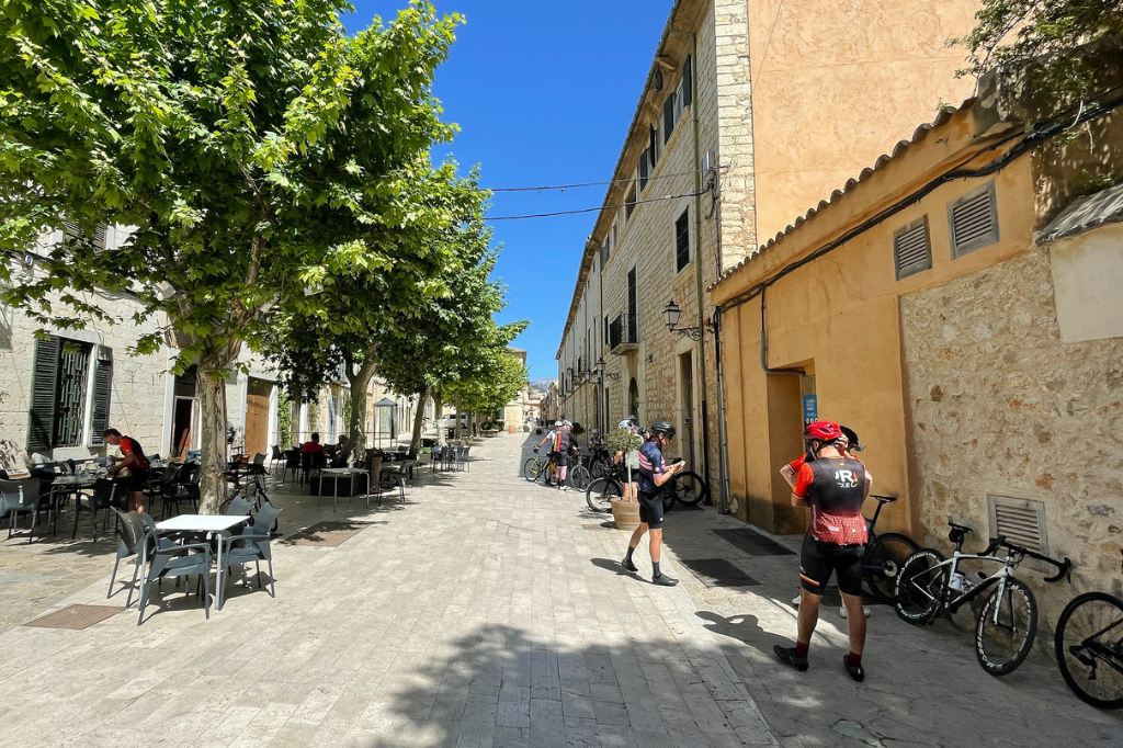 Cyclists on the streets of the old town in Binissalem, photo by Alexander Komlik, source flickr.com/photos/apkom/52203059695/