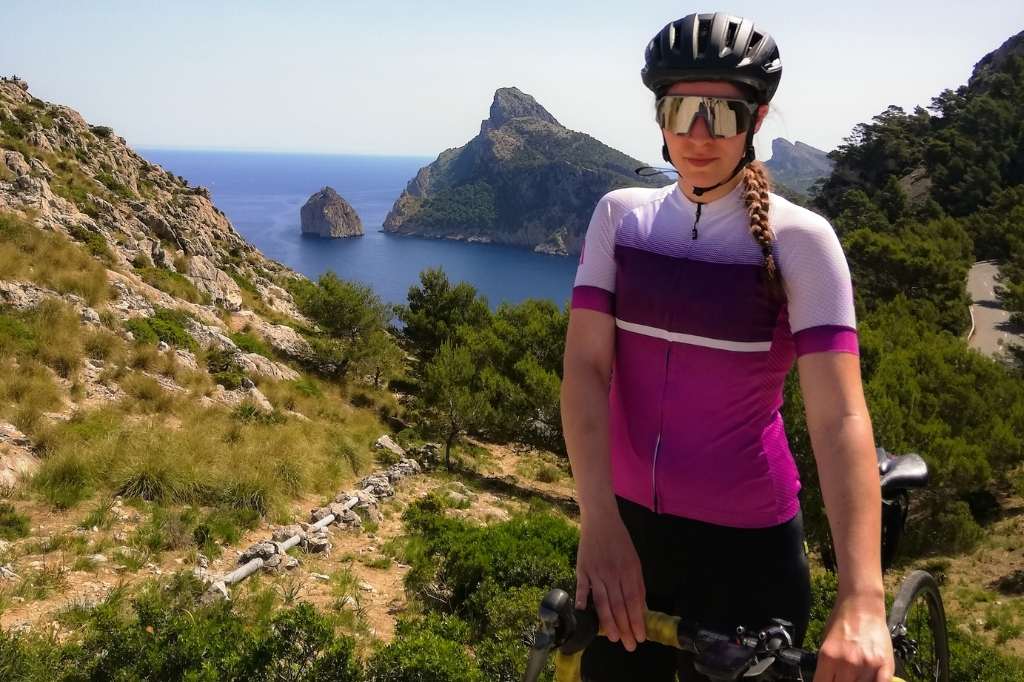 Happy woman portrait cycling around Mallorca