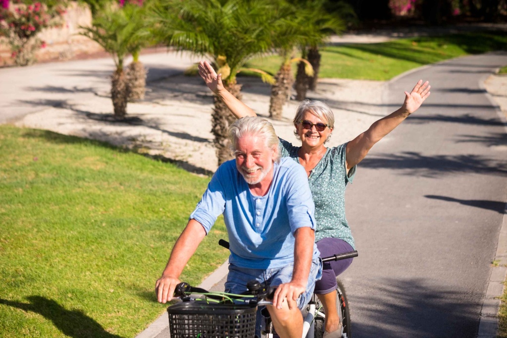 Elderly Couple riding a tandem bike in Mallorca